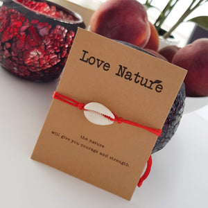 Love nature gift card with a white shell bracelet