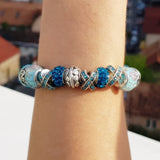 Blue Crystal Charm Bracelet on a girl's wrist