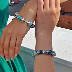 two girls each wearing a Blue Crystal Charm Bracelet