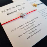 red string cross bracelet card
