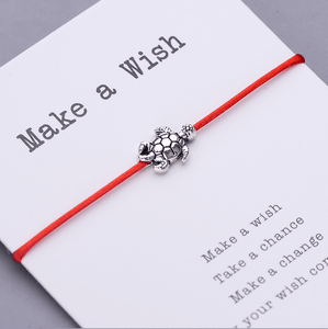 Make a wish res string bracelet with a turtle charm