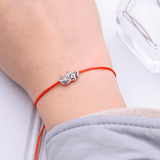retro elephant card bracelet on a girl's wrist